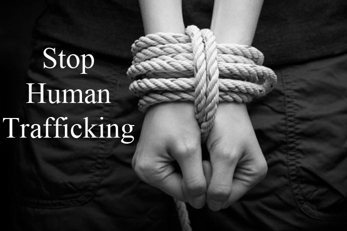 Powerful image advocating to stop human trafficking, showing hands bound by rope to symbolize the harsh realities of this global issue.