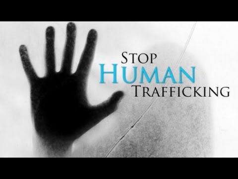 Graphic promoting awareness to stop human trafficking, featuring a shadowed hand and a call to action for ending this serious global issue.