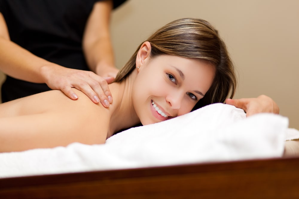Woman on massage table getting a Swedish massage
