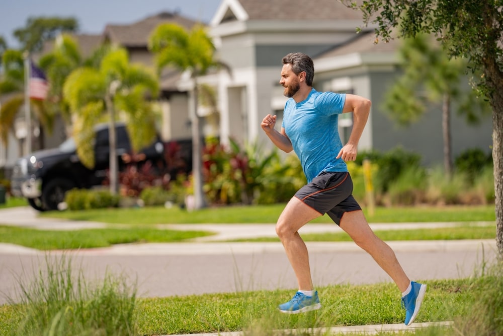 Man jogging in a suburban neighborhood