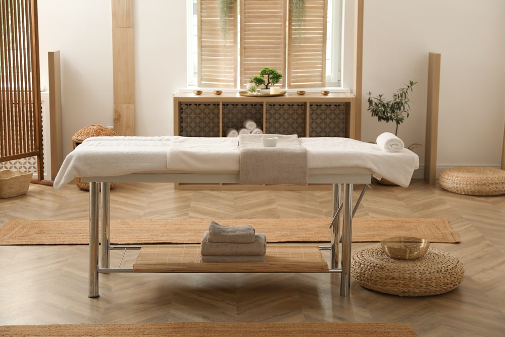 Massage table in the middle of a massage room